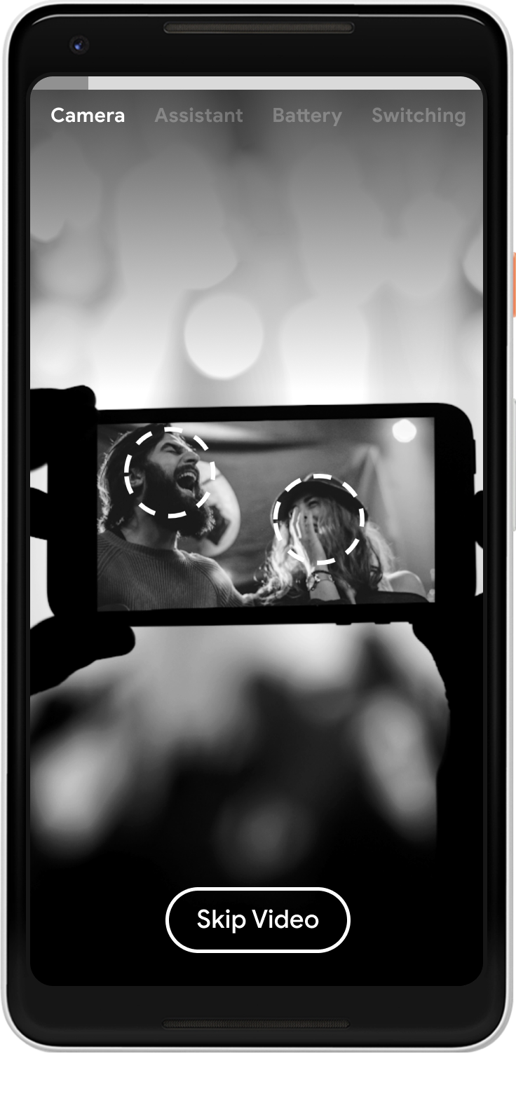 Video zooms in someone recording the concert on their phone, with the singers' faces highlighted on the phone